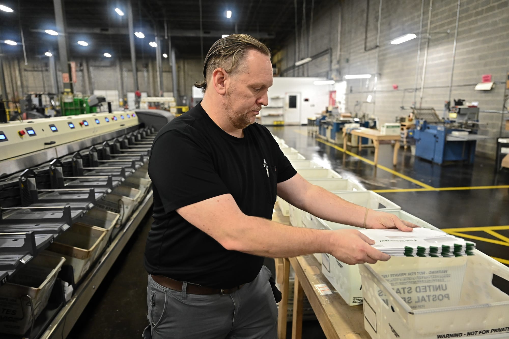 Dove Direct mailing supervisor inspecting operations